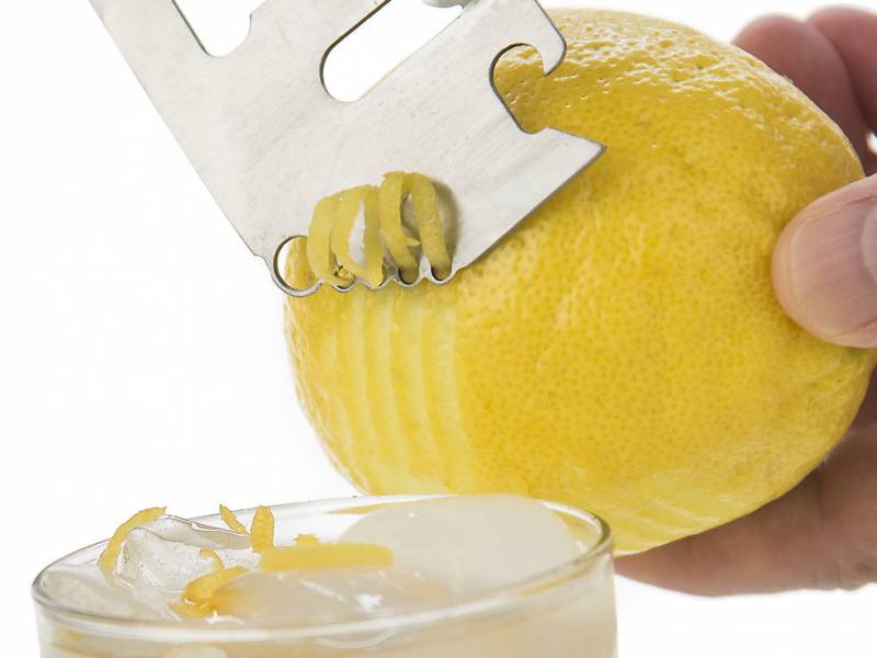 Barbarian Bar Tools' Simple Tool zesting a lemon.
