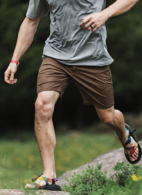 Man running in LIVSN Flex Canvas Shorts