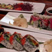 Three plats of sushi.