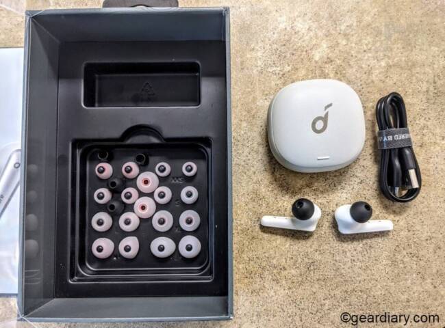 Soundcore Liberty Air 2 Pro earbuds with charging case, charging cable, and extra ear tips.