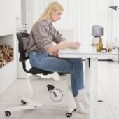 Woman sitting on a Flexispot Sit2Go 2-in-1 Fitness Chair.