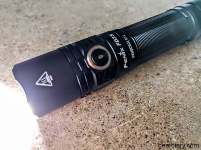 Fenix PD35 V3.0 Tactical Flashlight with light on.
