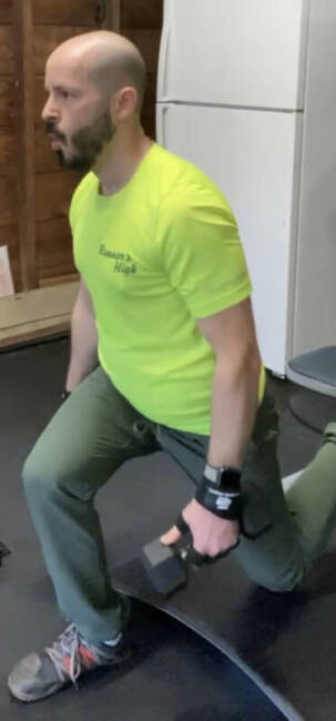 Man wearing Coalatree Trailhead Pants while exercising.