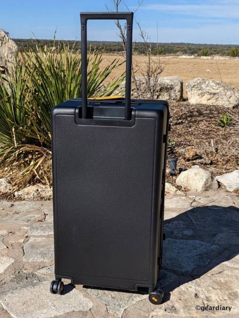 Back of the Level8 28" Luminous Trunk with handle raised