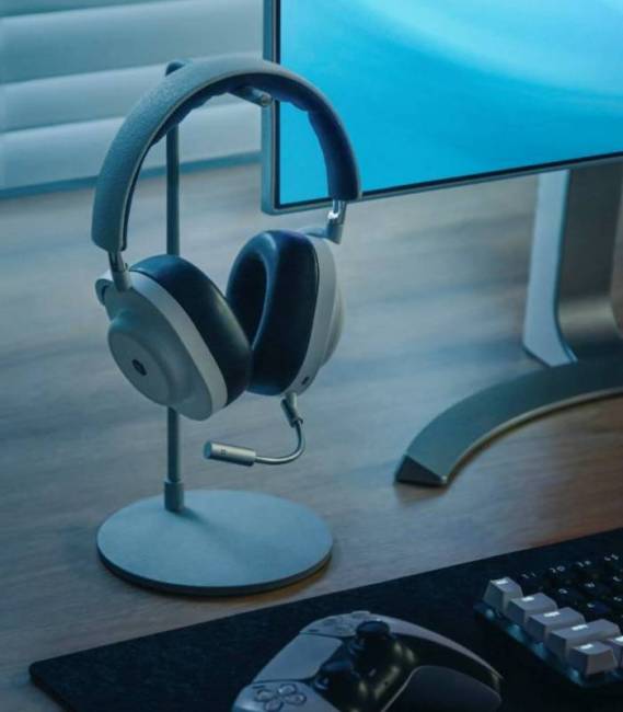 Master & Dynamic MG20 Wireless Gaming Headphones on stand