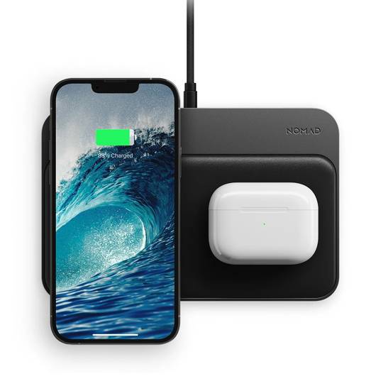 Nomad Base Station Hub Edition with Magnetic Alignment holding an iPhone and AirPods