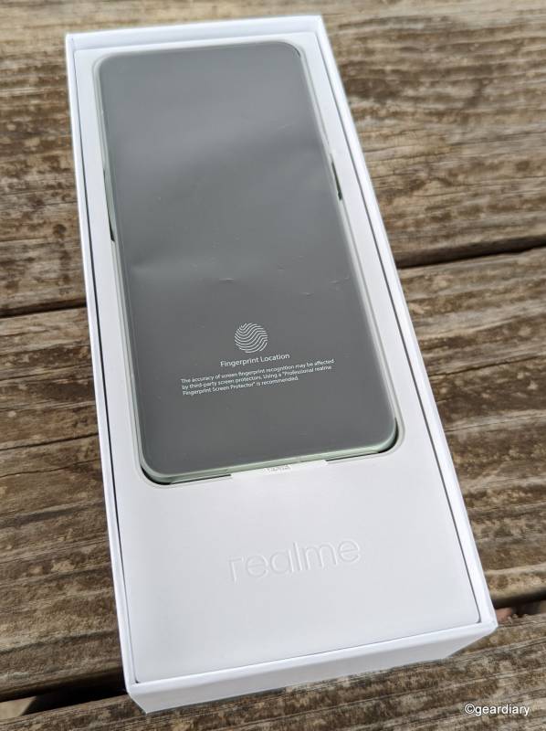 The realme GT 2 Pro wrapped in a protective plastic film.