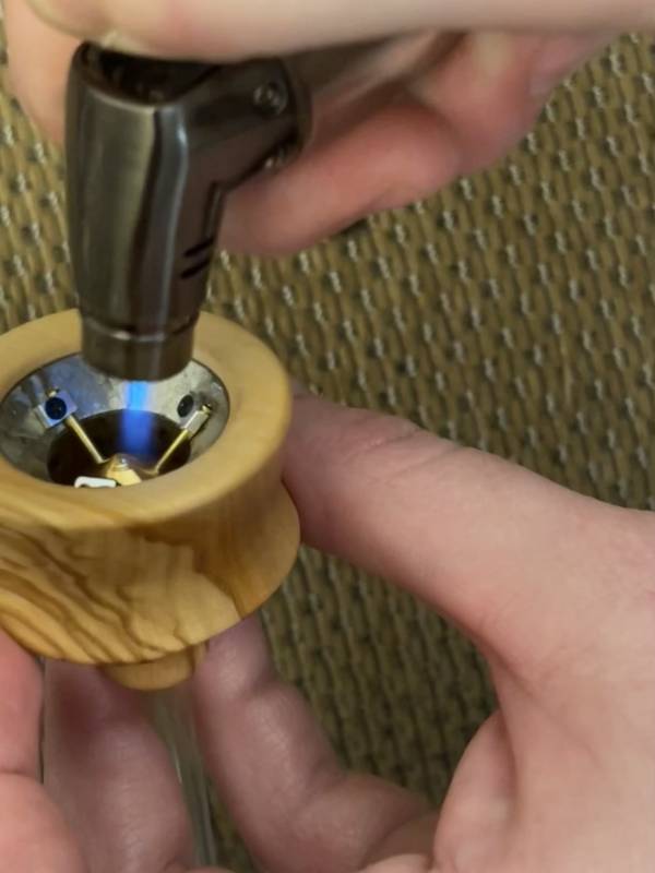 Applying the torch to the Vapman Classic Vaporizer 