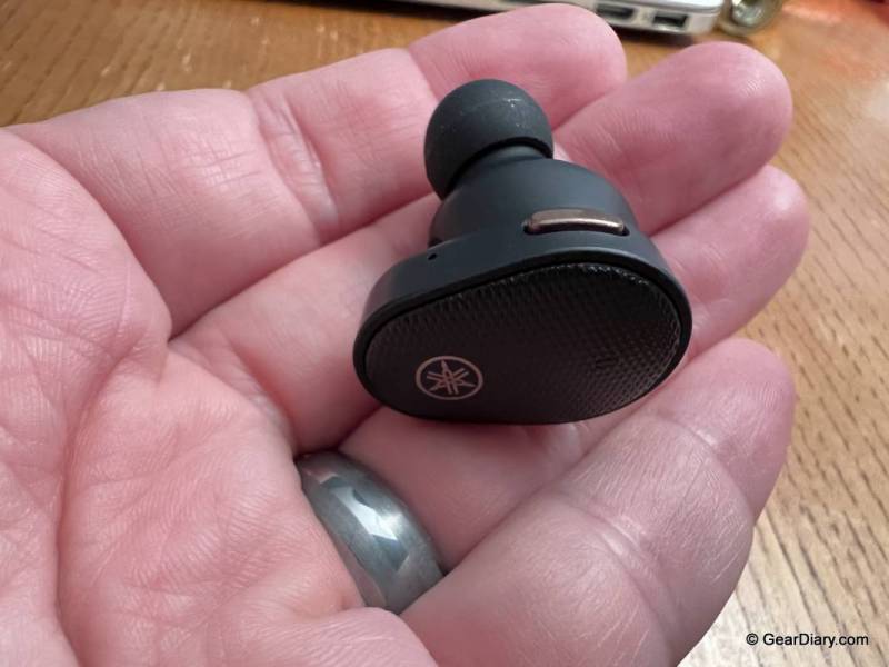 Yamaha TW-E5B True Wireless Earbuds in the suthor's hand.