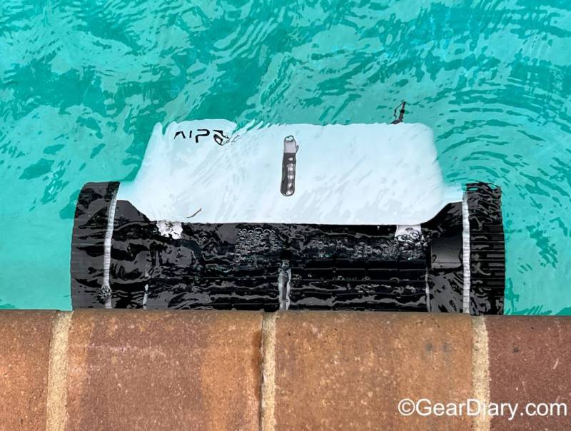 The Aiper Seagull 1500 Cordless Robotic Pool Cleaner cleaning the sides of the author's pool