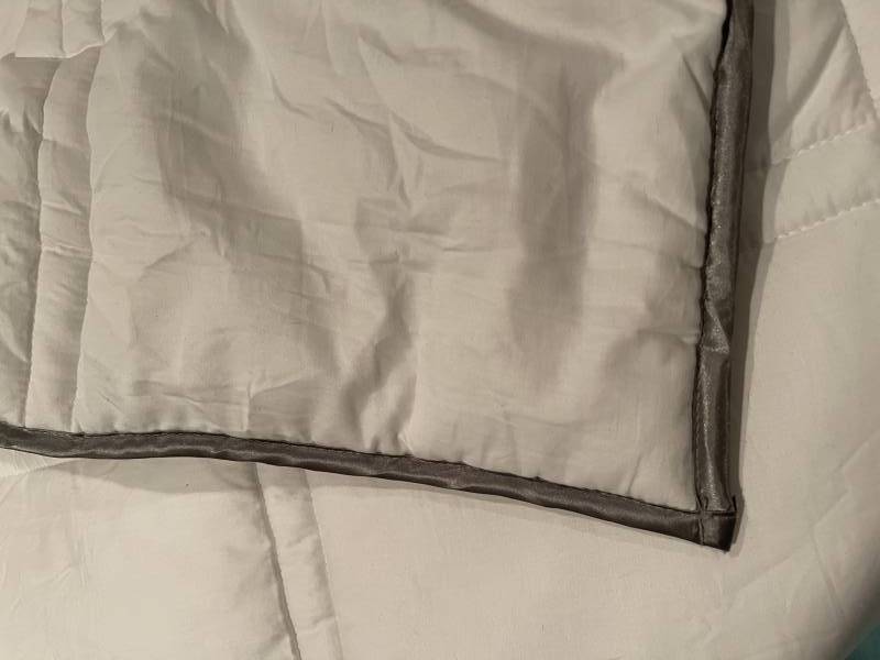 Edge detail of the Eli & Elm Weighted Comforter