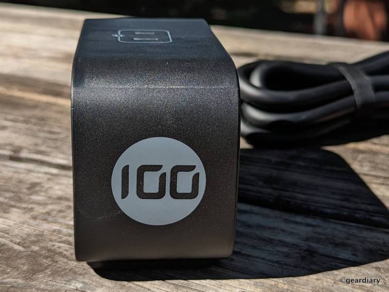 A stylized "100" on the side of the Ugreen 100W USB C DigiNest Pro Charging Station. The power cable comes out of the other side.