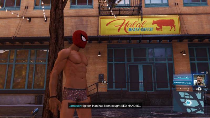 Spiderman stands with mask on and without his suit in Marvel's Spider-Man Remastered