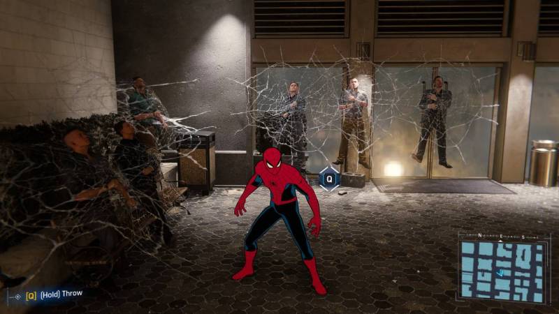 Spidey has thugs wrapped in his web in a scene from Marvel's Spider-Man Remastered
