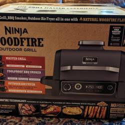 Front view of the Ninja Woodfire Outdoor Grill retail box