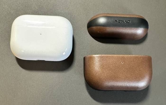 The Nomad Modern Leather Case for 2nd Gen AirPods next to the Airpods Pro.