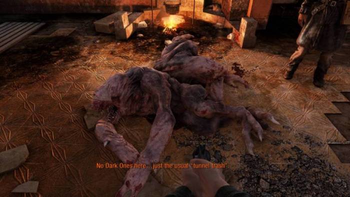 A scene in the game "Metro 2033 Redux" with the caption "No dark ones here ... just the usual tunnel trash!" 