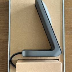 The Nomad Stand One MagSafe Charger inside the retail box