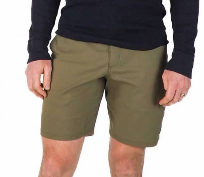 Man wearing a pair of army green LIVSN Ecotrek Trail Shorts; he is also wearing a long-sleeved black knit shirt