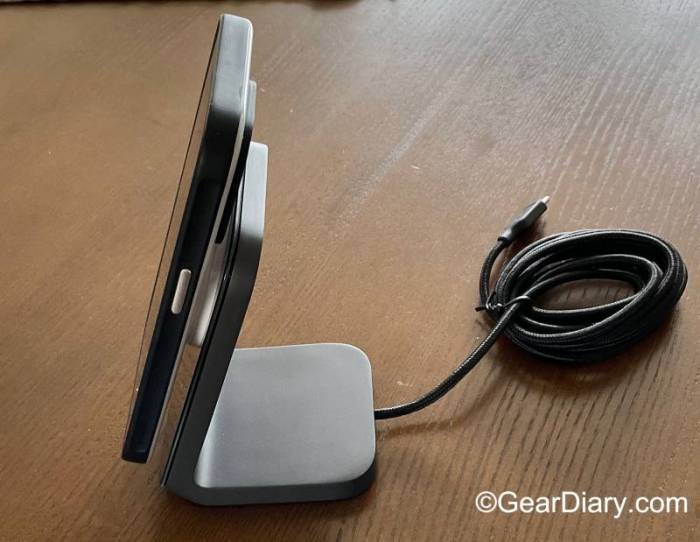 An iPhone resting on the Nomad Stand One MagSafe Charger