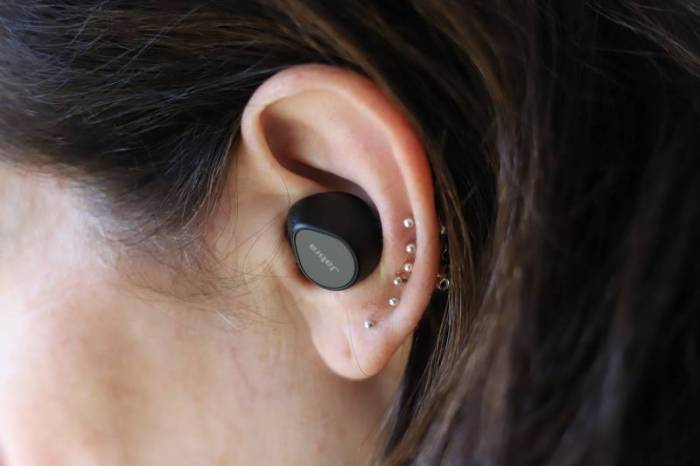 A Jabra Evolve2 True Wireless Earbuds in a wearer's ear