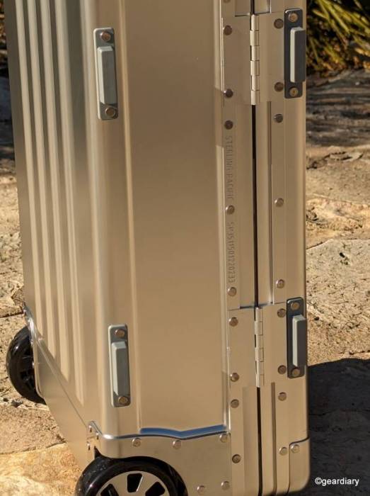 The left side of the Sterling Pacific 35L Cabin Travel Case showing the hinges and protective feet.