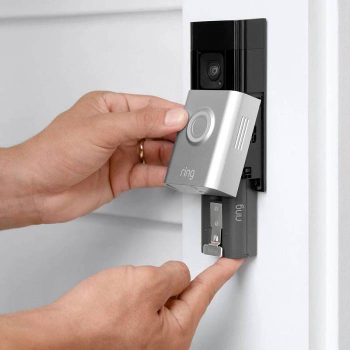 A person releasing the rechargeable battery pack on the The Ring Battery Doorbell Plus 