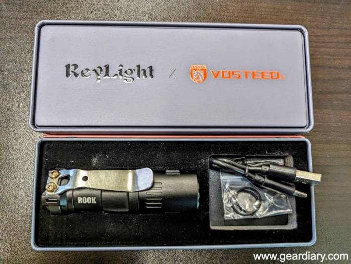 The ReyLight X Vosteed Rook Flashlight in it's retail packaging