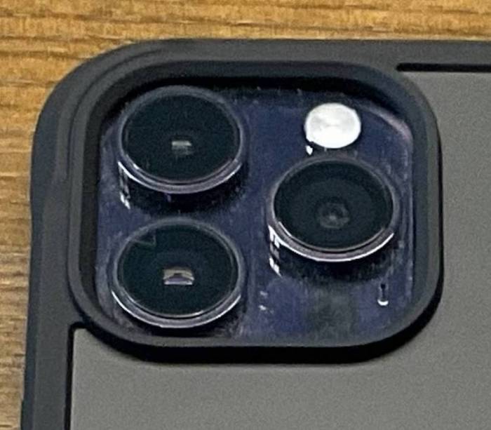 The raised edges around the iPhone 14 Pro's camera array on the Nomad x Peak Design Rugged Case