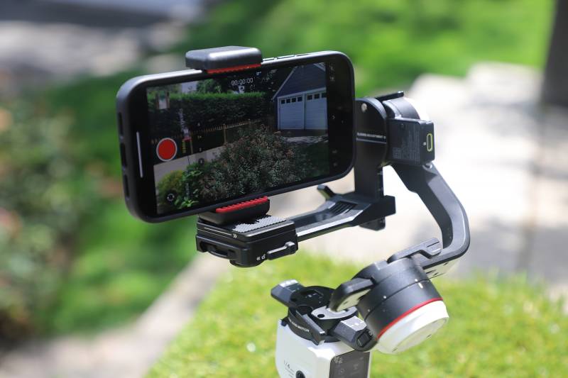 The Zhiyun Crane-M 3S with a smartphone mounted on it