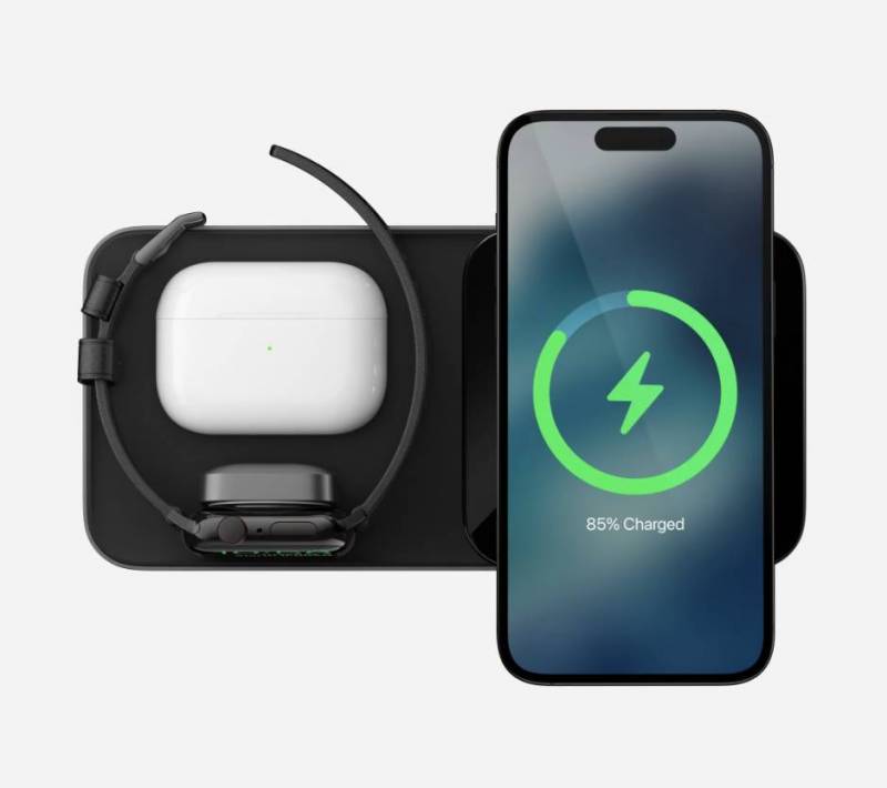 Top view of Apple iPhone, Apple Watch, and AirPods charging on the Nomad Base One Max 3-in-1 MagSafe Charger