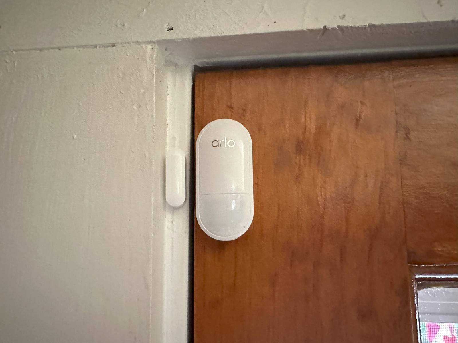 Arlo Home Security System sensor placed on door