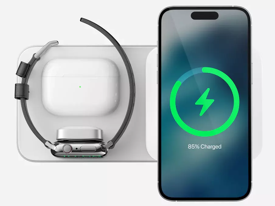 Top view of the Nomad Base One Max 3-in-1 MagSafe Charger in Silver & White with iPhone, Apple Watch, and AirPods being charged simultaneously
