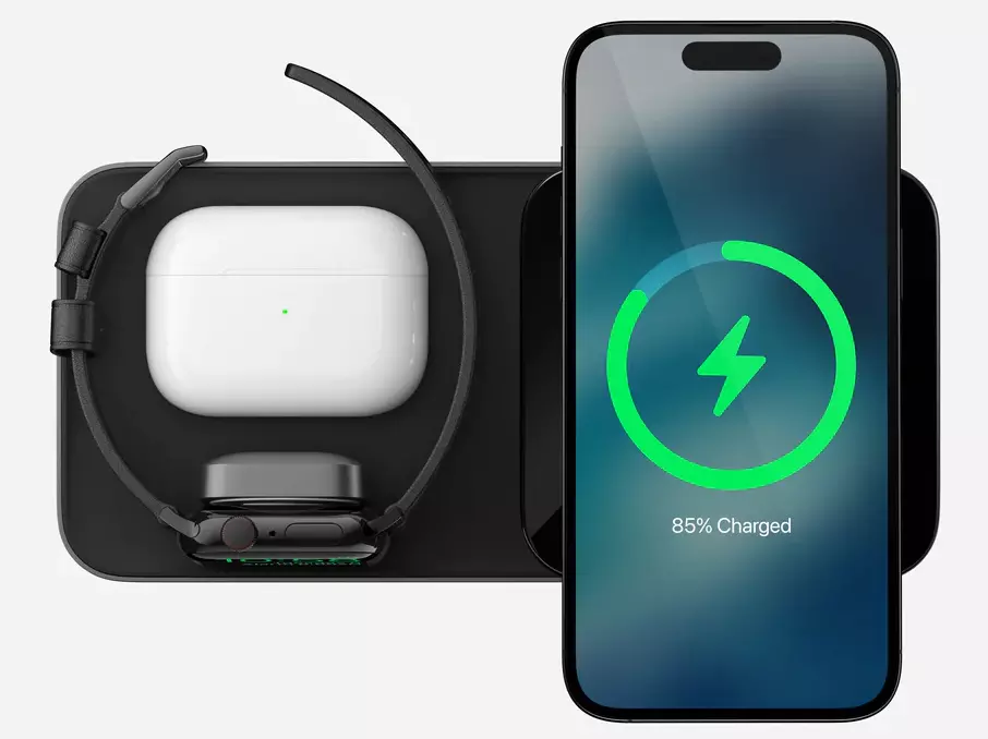 Top view of the Nomad Base One Max 3-in-1 MagSafe Charger in Carbide & Black with iPhone, Apple Watch, and AirPods being charged simultaneously