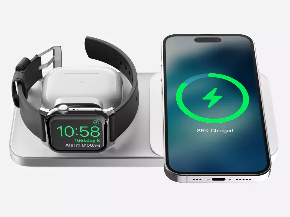 Front view of the Nomad Base One Max 3-in-1 MagSafe Charger in Silver & White with iPhone, Apple Watch, and AirPods being charged simultaneously