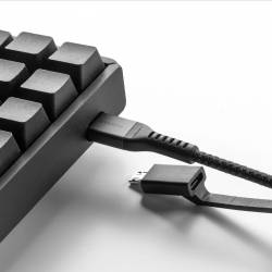 The Nomad Universal Cable USB-C plugged into a keyboard