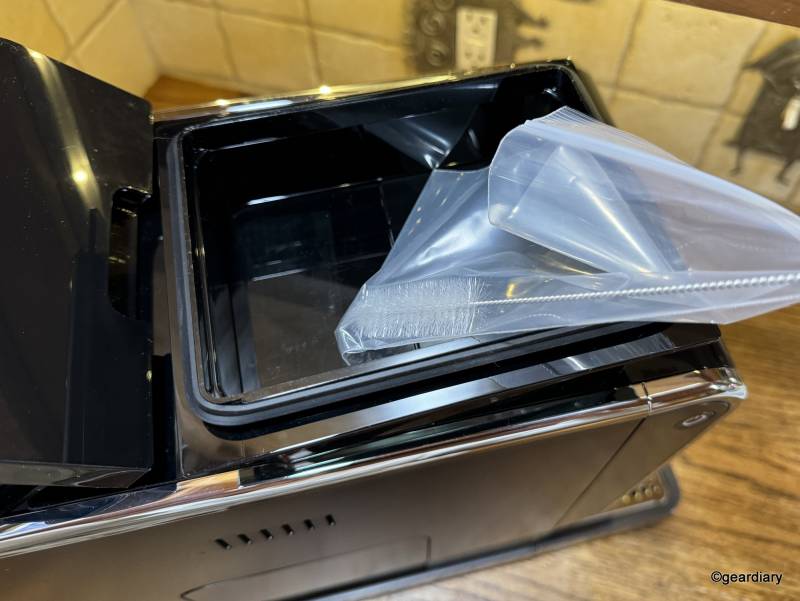 Tchibo Bean-to-Brew Coffee Machine Review: A Compact and Convenient All-in-One Espresso and Coffee Brewer 5 A cleaning brush and coffee hopper extender are included