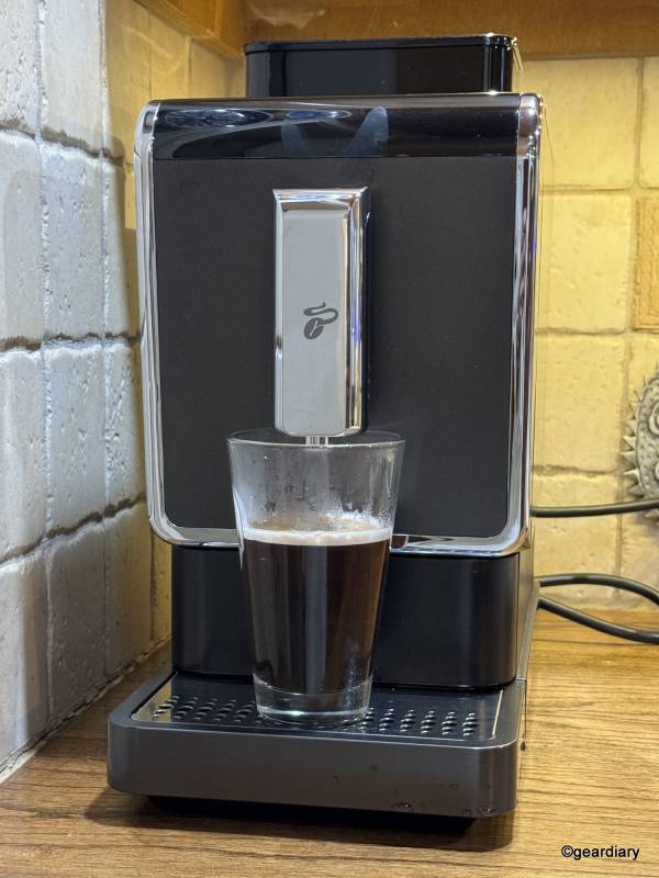The Tchibo Bean-to-Brew Coffee Machine with a freshly brewed cup of coffee.