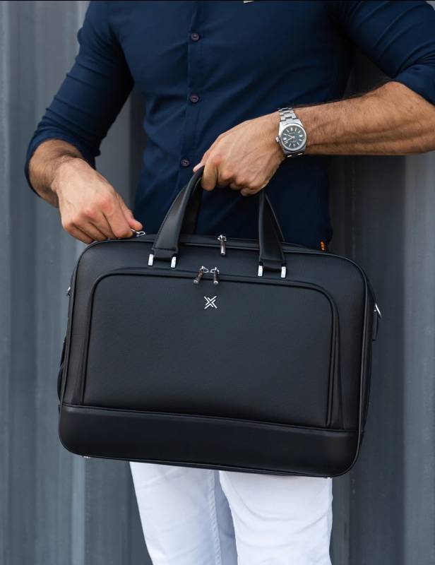 Stock photo of a man carrying the xBriefcase
