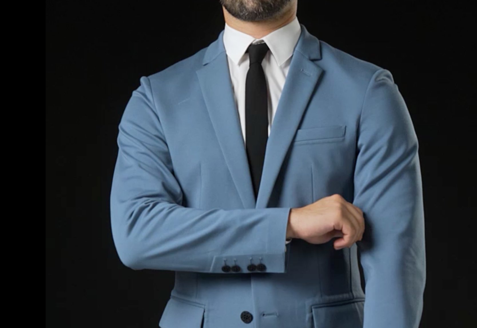 Man pulling on the sleeve of a light blue xSuit 4.0