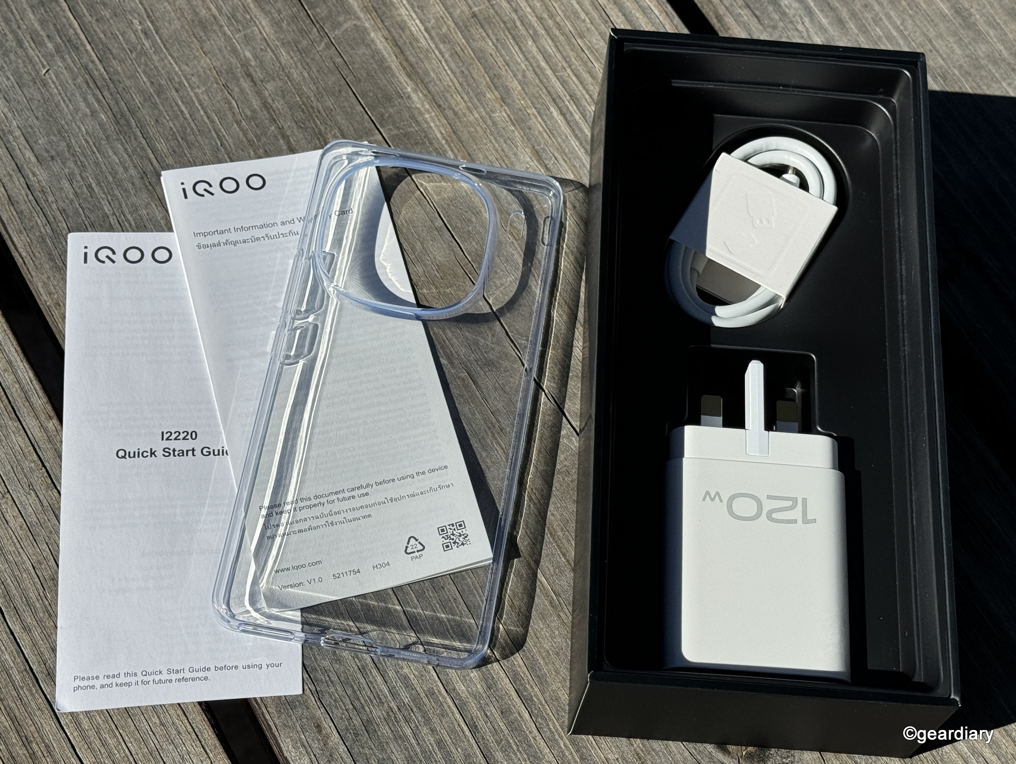Screen protector, charger, charging cable, and paperwork inside the IQOO 12 Legend Edition retail box