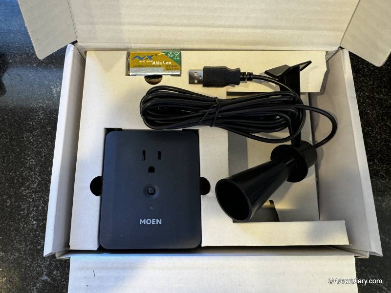 Contents inside the Flo by Moen Smart Sump Pump Monitor retail box