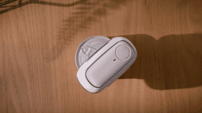 GIF showing the Kitchen Mama Orbit One Can Opener opening a can.