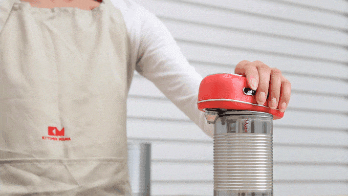 GIF showing a can's lid easily coming off when using the Kitchen Mama Orbit One Can Opener.