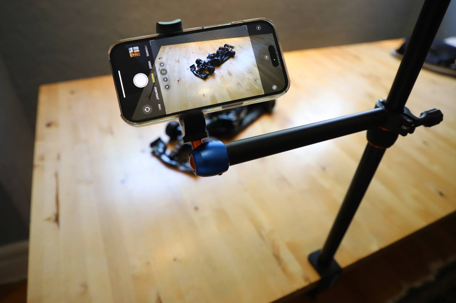 A smartphone attached to the 3 Legged Thing CDMS Kit 2A Camera Desk Mount System