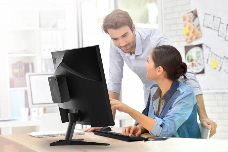 Acer Revo Box AI mounted on the back of a monitor