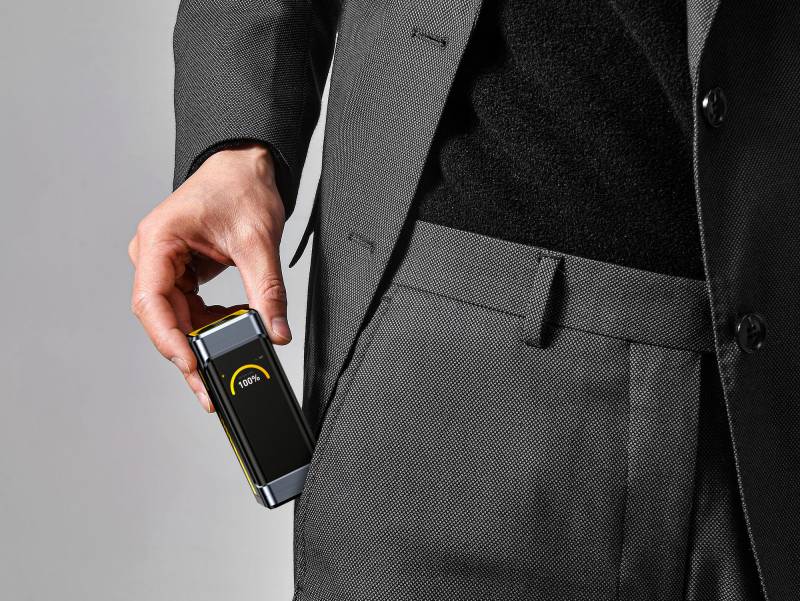 AOHi Starship Pro going into a man's front pocket.