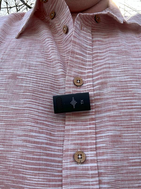 3 Legged Thing Str3amcase clipped to a button down shirt placket