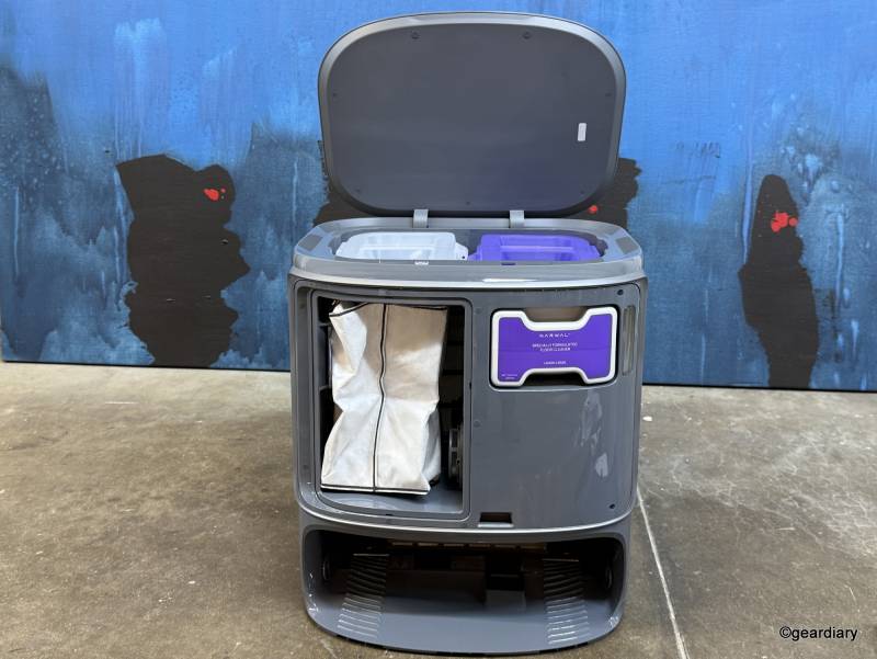 The dust bag and floor detergent installed in the front of the Narwal Freo Z Ultra base station.