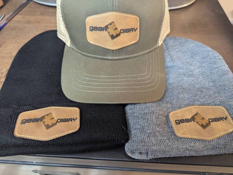 Various caps with Gear Diary patches made with the AlgoLaser Alpha MK2 20W Diode Laser Engraver
